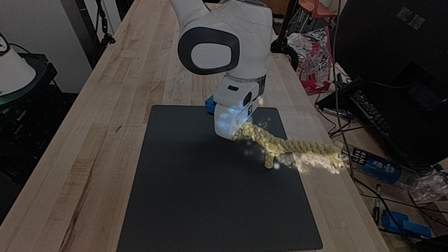 AuRA first-frame Gaussian rendering overlaid on the unseen interaction